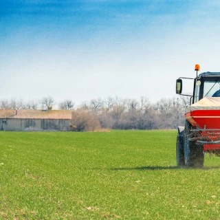 agricultural-tractor-fertilizing-wheat-crop-field-2021-08-26-23-03-13-utc (Phone)