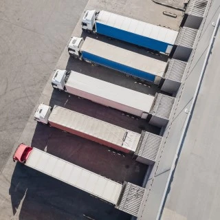 trucks-unloading-in-logostics-center-2021-12-09-11-04-02-utc (Phone)