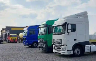 A fleet of commercial trucks including DAF and Mercedes HGVs — asset finance for vehicles available through Percy Finance Ltd