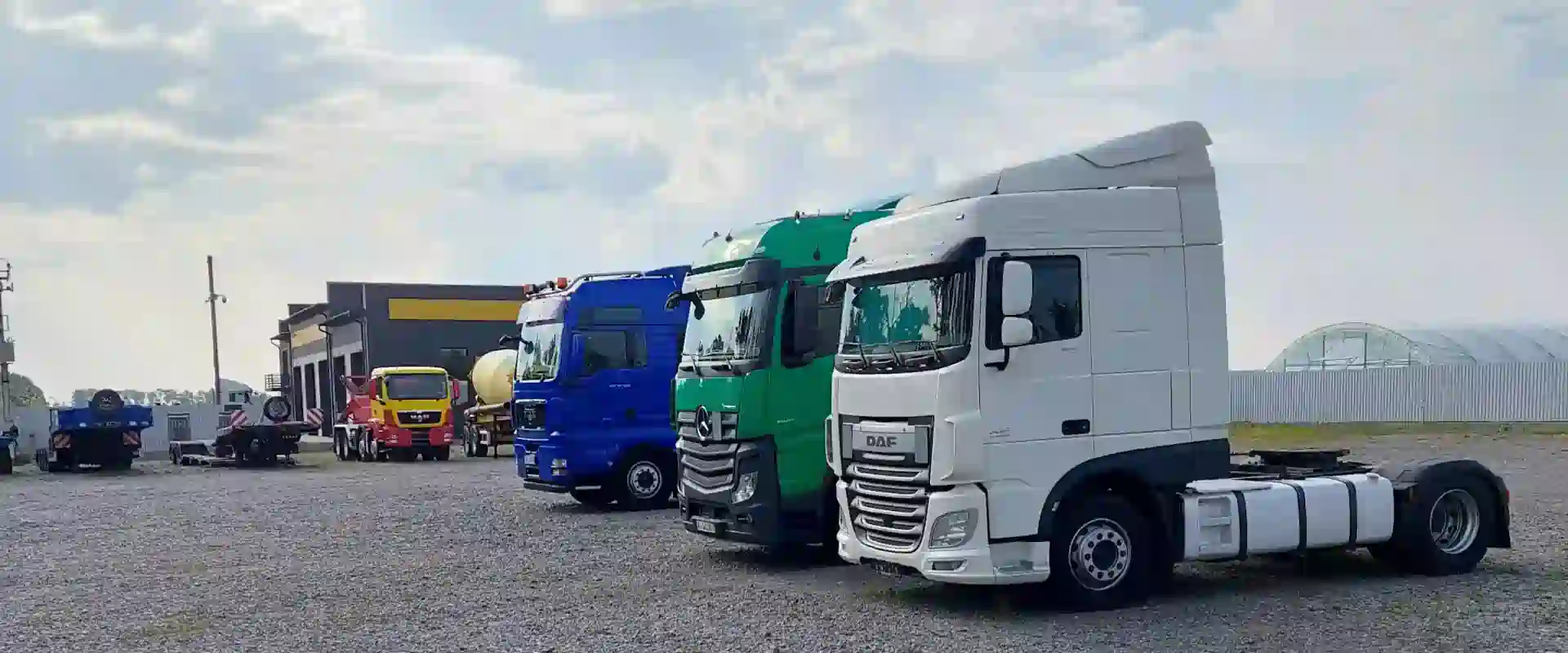 A fleet of commercial trucks including DAF and Mercedes HGVs — asset finance for vehicles available through Percy Finance Ltd